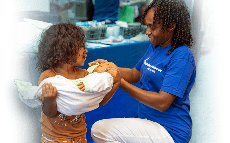 Person volunteering with a child